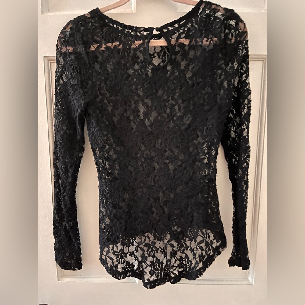 Long sleeve lace peplum top.